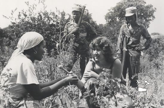 Julie Frederikse conducting an interview with a woman in rural Zimbabwe. Photograph by Biddy Partridge. Archived as SAHA collection AL2460_U06.02