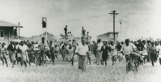 Protesters fleeing from police outside the Sharpeville Police Station on March 21, 1960. 