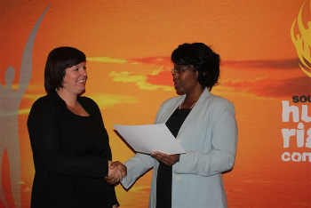 Tammy O'Connor receives 'best promoter' of PAIA award from the SAHRC on behalf of SAHA